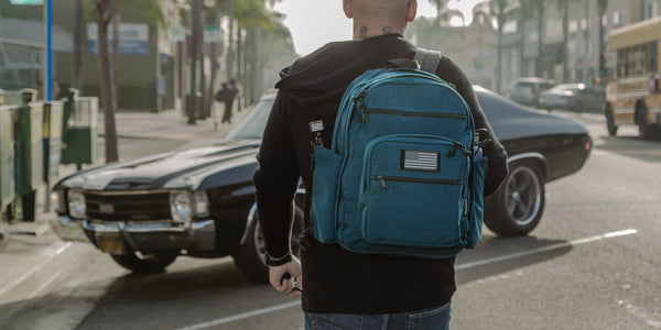 A real Maxpedition user carries his Prepared Citizen Deluxe - an Everyday Carry product - as he walks towards his car.